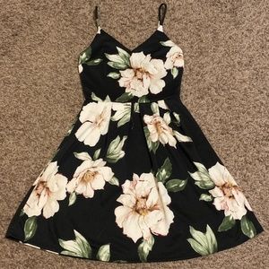Small women's black floral sleeveless dress.